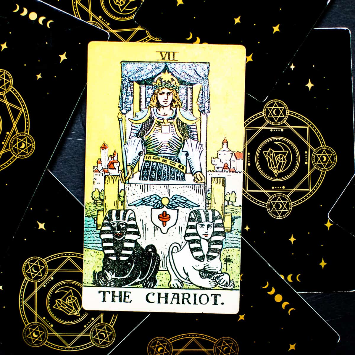 The Chariot card from the original Rider Waite tarot deck illustration.