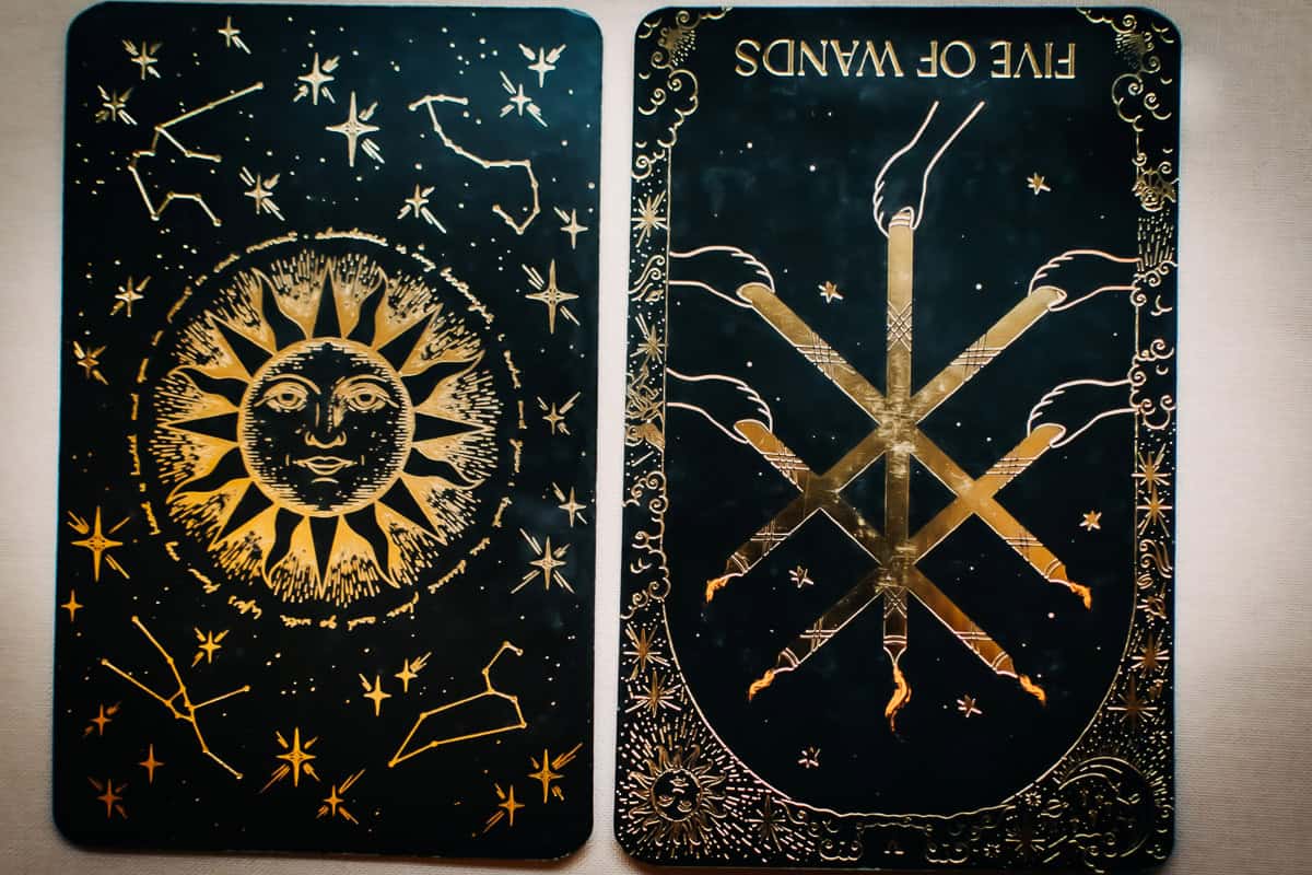 Five of Wands feelings card in the reversed position. 