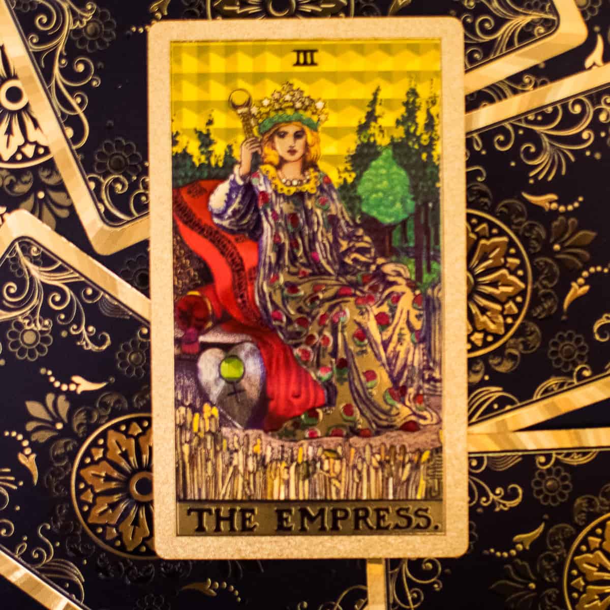 An Empress on her throne as depicted on a tarot card.