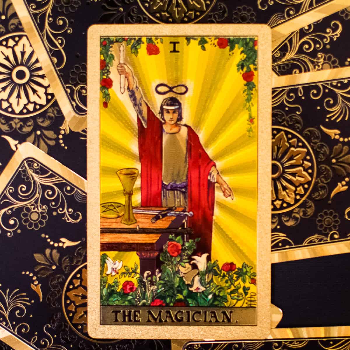 A figure in a robe holding a double edged staff up with an infinity symbol above his head, as depicted on a tarot card.
