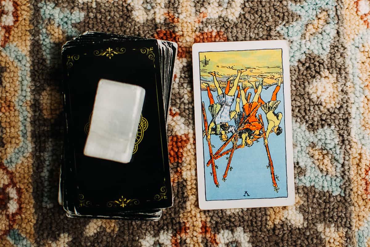 The Five of Wands card in the reversed position.