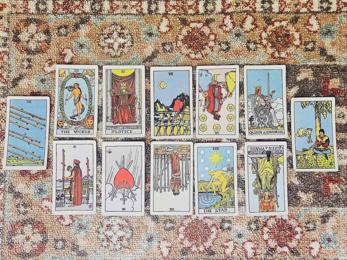 A tarot spread featuring upright and reversed cards.