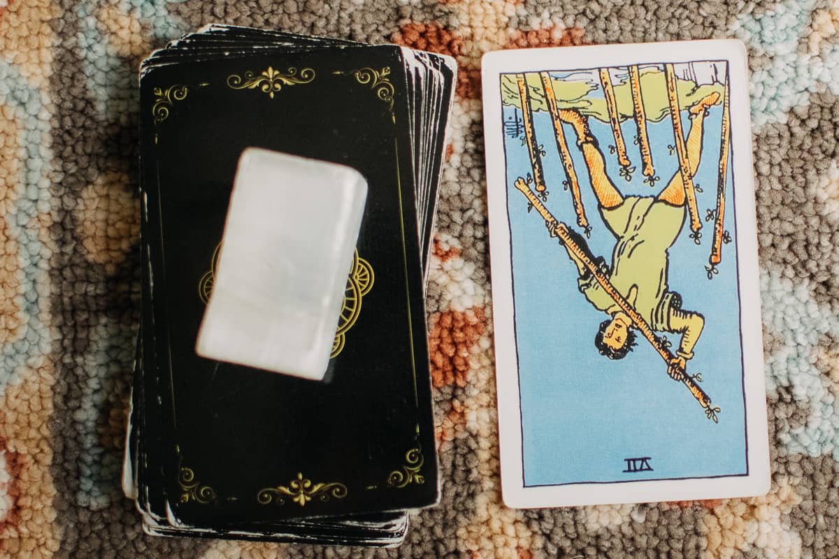 The Seven of Wands tarot card in the reversed position.