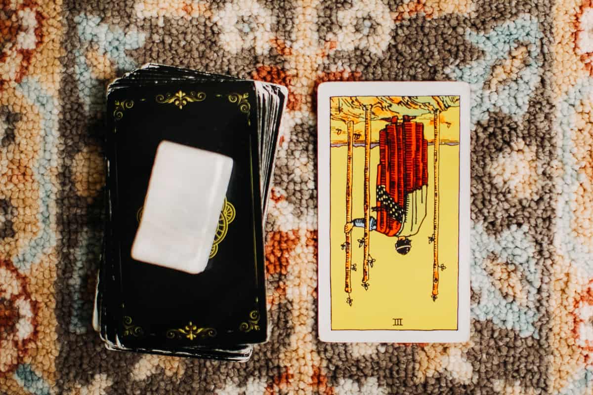 Three of Wands card in the reversed position. 