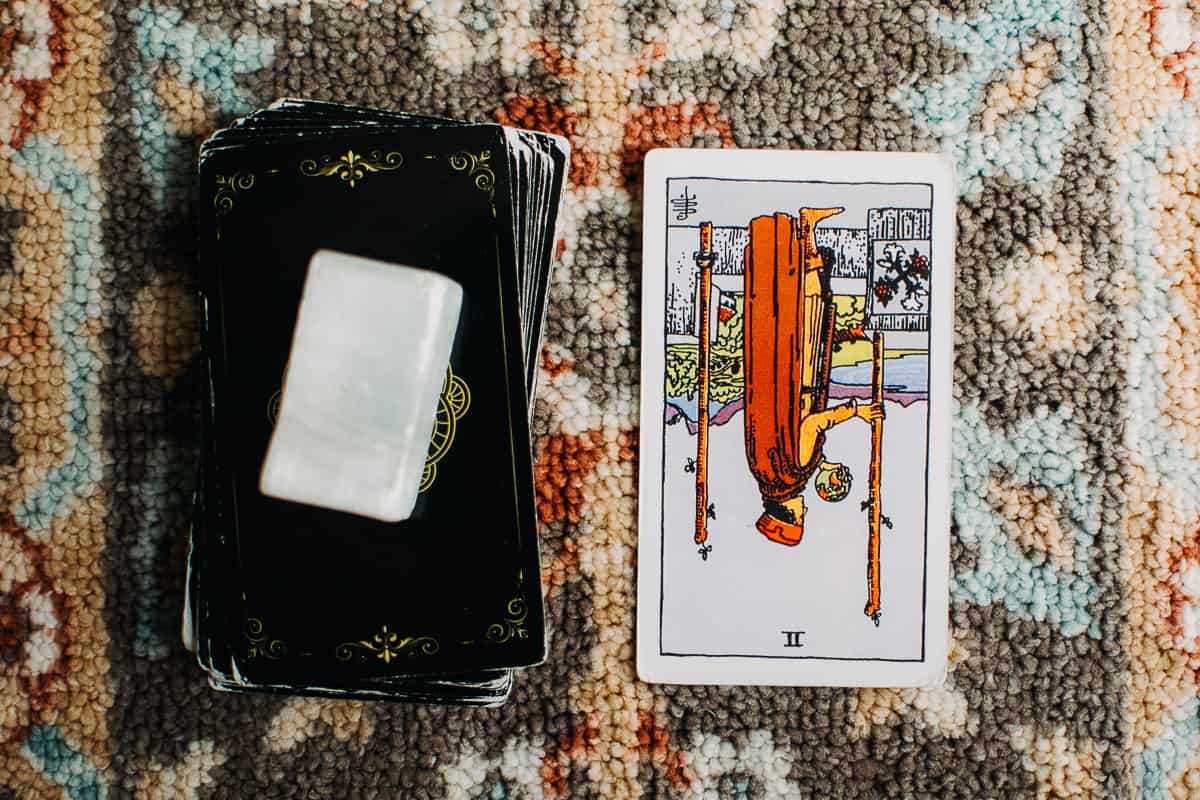 Two of Wands card in the reversed position.